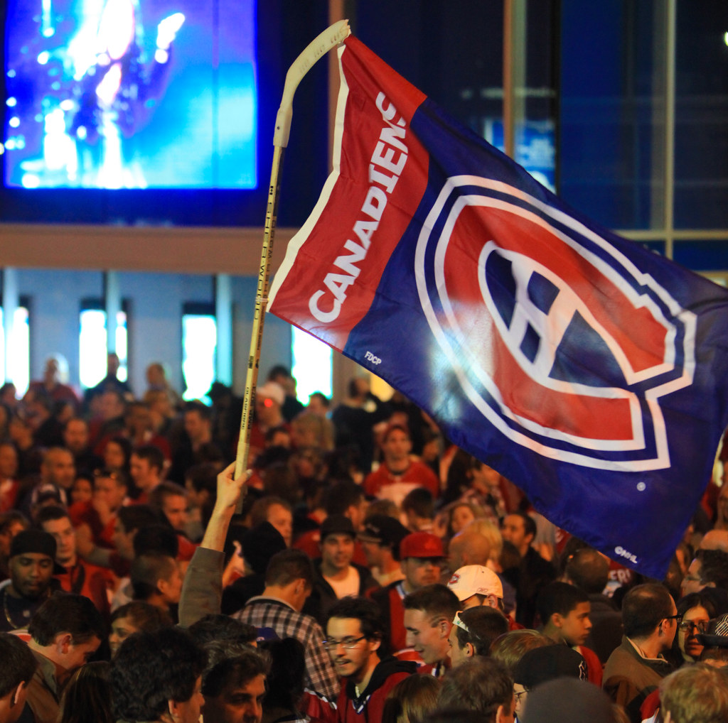 "Montreal Canadiens Fan Celebration - Hockey Stick Flag" by Anirudh Koul is licensed with CC BY-NC 2.0. To view a copy of this license, visit https://creativecommons.org/licenses/by-nc/2.0/